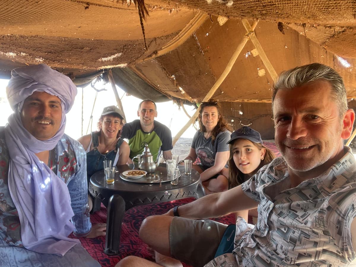 Camel trek across the golden dunes of Erg Chebbi near Merzouga
